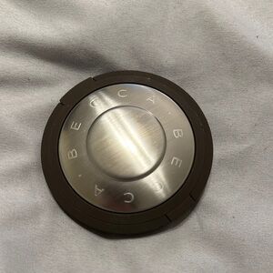 BECCA Compact with Metallic and Dark Brown Finish